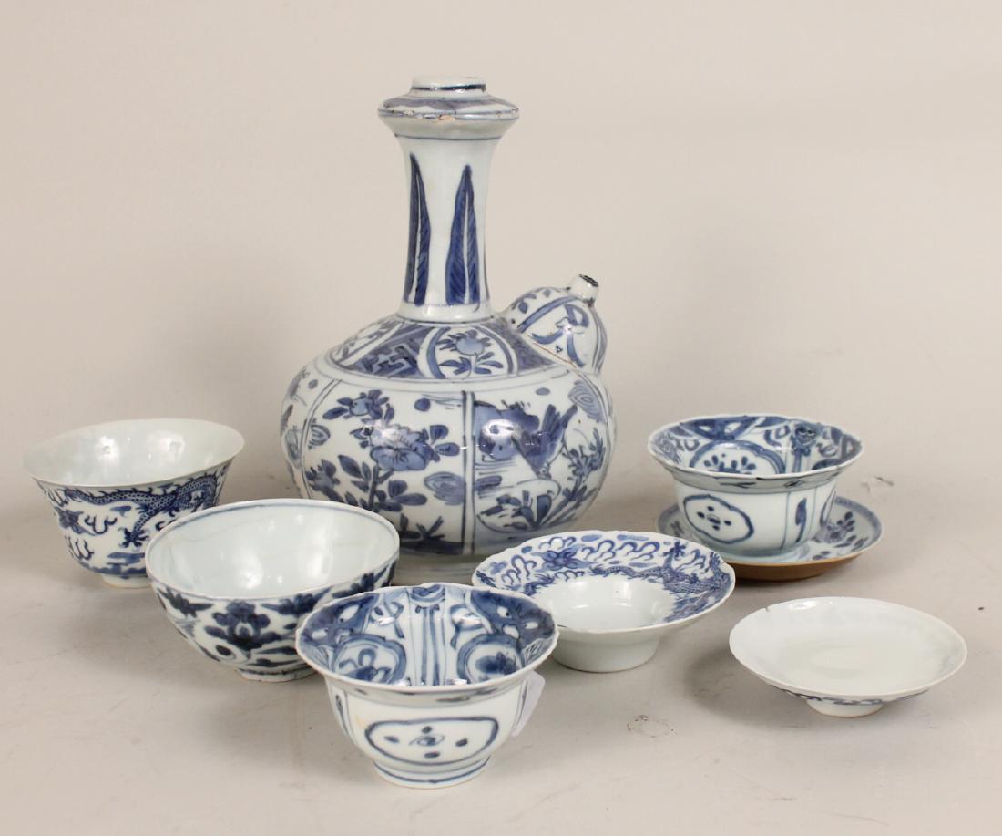 Chinese Blue and White Porcelain Articles: Including a Kendi Wan Li Period, pair of Kraak bowls, tea cups and saucer with Chien Lung mark, Ming cup, Ming Dynasty saucer and a cover/lid. Kendi 10"h Provenance: The Kendi: Christies NY lot 6/1/19