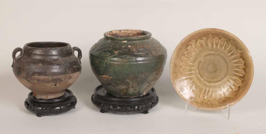 Chinese Han Dynasty Green Glazed Jar: Globular form with a frieze of striding dragons. Together with a Chinese green glazed jarlet and a Thai yellow glazed flower motif dish. Han dynasty jar 5"h Provenance: Property from the Collection of