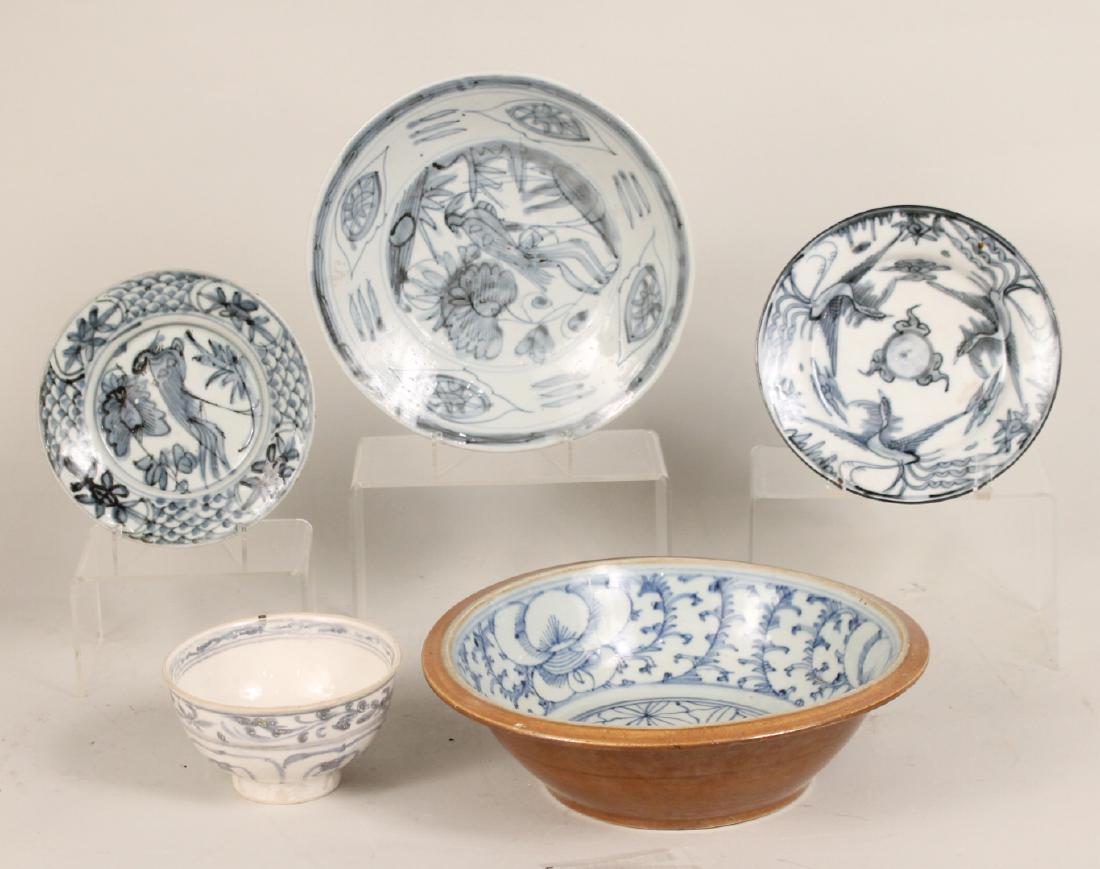 Five Chinese Blue and White Porcelain Articles: Comprising three Swatow plates, Ming Dynasty rice bowl and a open bowl. Largest 3 1/2"h x 11"d Provenance: Property from the Collection of Dr. Andrew and Ziva Dahl.