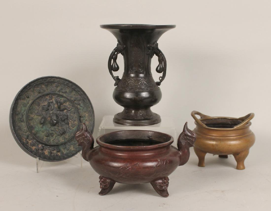 Four Chinese Bronze Articles: Comprising two Ming censors, a Ming vase and a Tang mirror. Mirror 6 1/2"h Provenance: Property from the Collection of Dr. Andrew and Ziva Dahl.