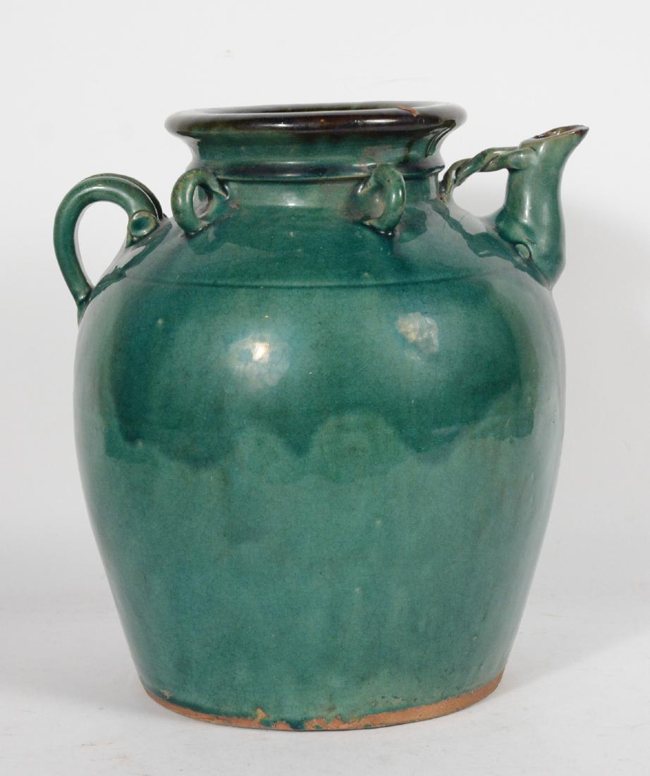 Chinese Ming Dynasty Green Glazed Stoneware Ewer: 13 1/2"h Provenance: Property from the Collection of Dr. Andrew and Ziva Dahl. IM Chait Gallery, Beverly Hills, CA