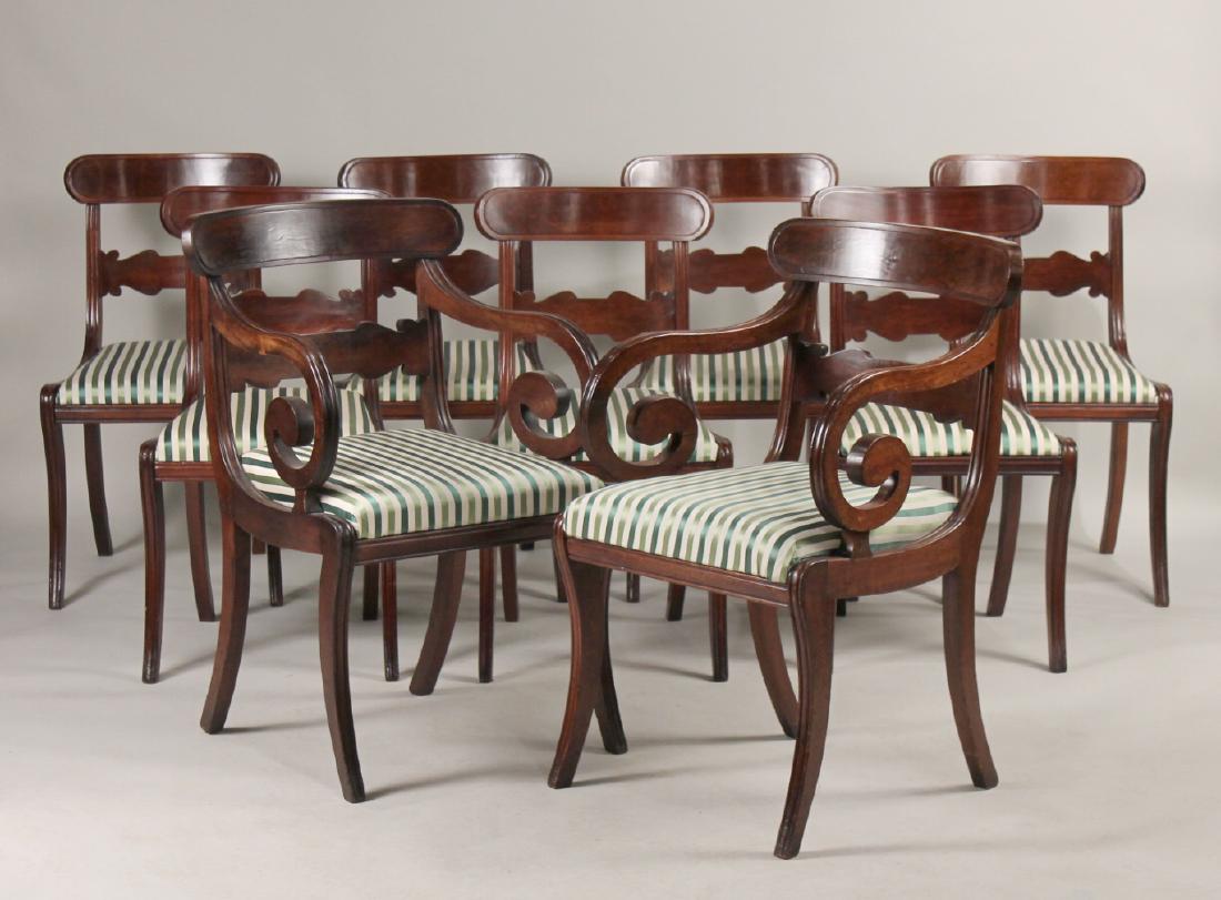 Nine Federal Mahogany Dining Chairs: American, c. 1815-1820, comprising seven side chairs and two armchairs, one armchair labeled "N.C. Thompson, upholsterer and cabinetmaker, Harvard Square, Brookline, Mass." 33"h and 34-1/2"h Provenanc