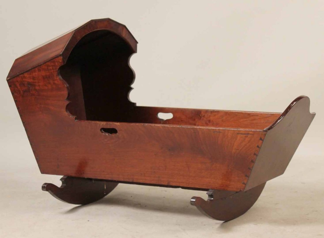 Mahogany Hooded Baby Rocking Cradle: American, 18th/19th C. Apx. 29-1/2"h x 47"w x 20-1/2"d Provenance: Property from the Collection of Dr. Andrew and Ziva Dahl.