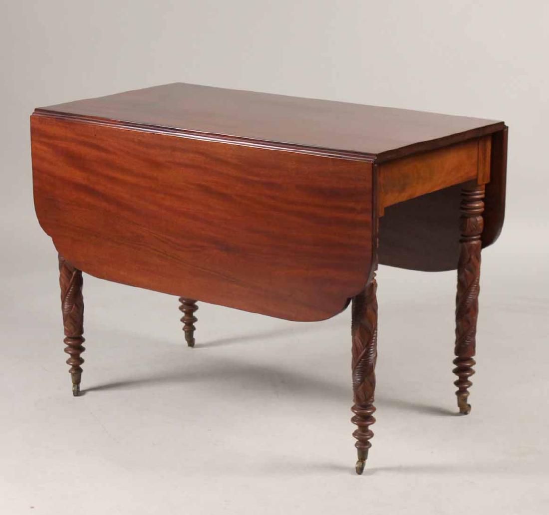 Sheraton Carved Mahogany Drop Leaf Table: American, c. 1840. 29-1/4"h x 40"w x 22-1/2"d Provenance: Property from the Collection of Dr. Andrew and Ziva Dahl.