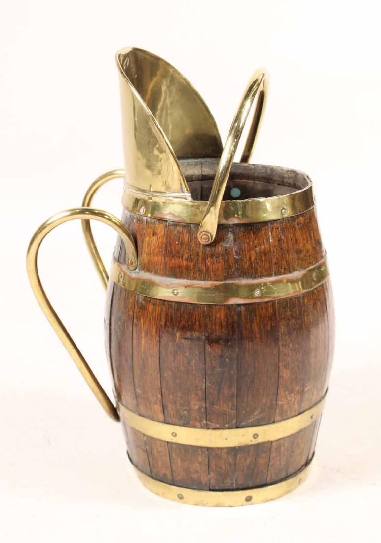 Victorian Wood and Brass Coal Bin: English, c. 1885, in the shape of a barrel. Provenance: Property from the Collection of Dr. Andrew and Ziva Dahl. Patricia Drak Keady, Drake Field Antiques, Longmeadow, MA, 6/24/1995.