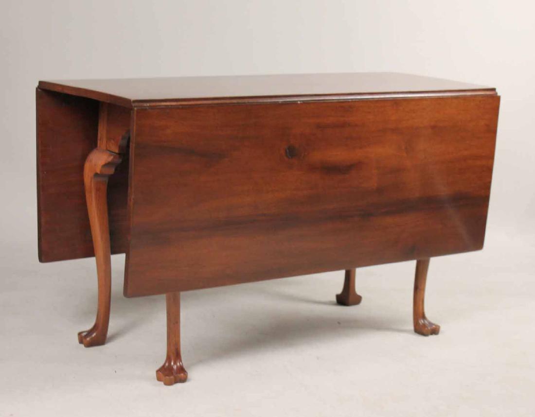 Queen Anne Walnut Drop Leaf Dining Table: Pennsylvania, c. 1760-1780. 28-1/2"h x 47-1/4"l x 19"w, closed Provenance: Property from the Collection of Dr. Andrew and Ziva Dahl. Sotheby's 6051/31, 6/28/1990.
