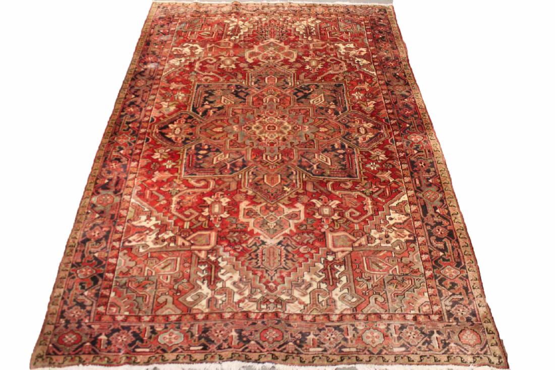 Heriz Carpet: Mid-20th C., worked in tones of red, blue, green, and ivory. 7'10"w x 11'6"l Provenance: Property from the Collection of Dr. Andrew and Ziva Dahl. Copake Auctions, Lot 14 .