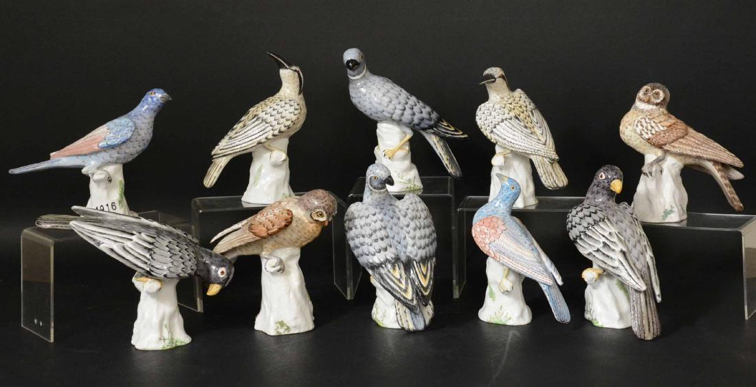Five Pairs Crown Staffordshire Porcelain Birds: Signed underside M. Doubell Miller. Comprising "Blue Hawk,"Solitary Sparrow," "Black Parrot," "Hawk Owl," and "Black & White Kingfisher." Tallest 8"h Provenance: Property from the Collection of Dr. An