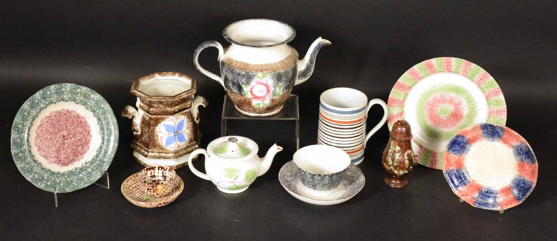 Assorted Group of Spatter Ware Table Articles: English, 19th Century. Including green and white "Peafowl" pattern, brown and white, black and white and "Rainbow" pattern, cups and saucers, sugar bowl teapot and a child's teapot. Together with a mo