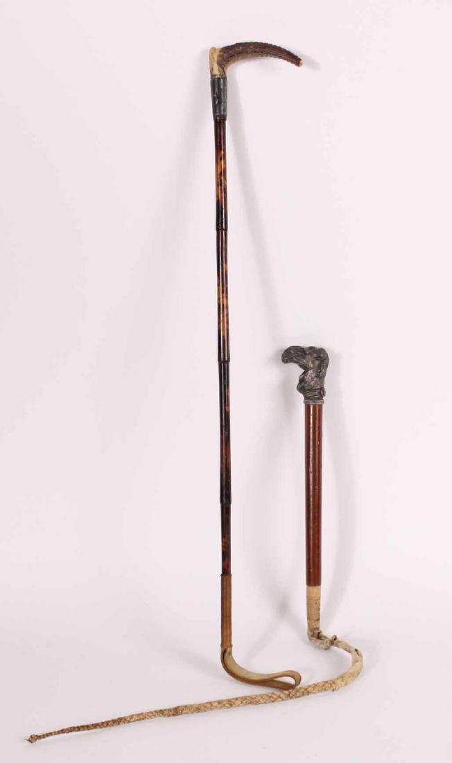 Two Riding Crops: One with antler and sterling handle and one with metal camel-head handles. 28"l and 29"l Provenance: Property of Major General Charles Francis Roe (1848-1922). Descended through the family to the grea