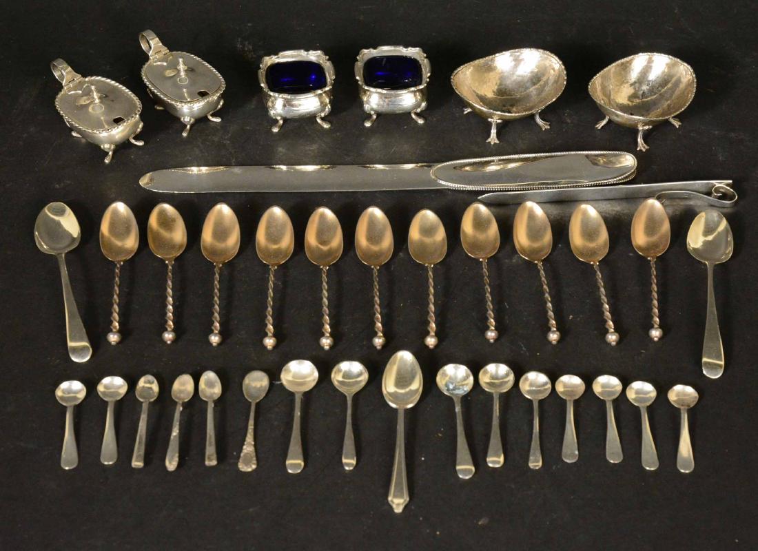 Group of Sterling Silver Items: Comprising two letter openers, a pair of English salt cellars with cobalt blue glass liners,two pair of 800 silver salt cellars, 15 salt spoons, 3 coffee spoons, set of 11 vermeil coffee spoons with t