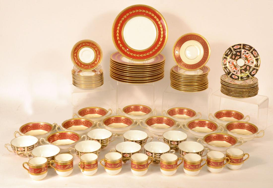 Royal Crown Derby Porcelain Cups and Saucers: Retailed by Tiffany & Co. Comprising nine tea cups and eleven saucers. Together with an assembled Minton porcelain dinner service retailed by Tiffany comprising 11 9" plates, twelve each bouillon cups