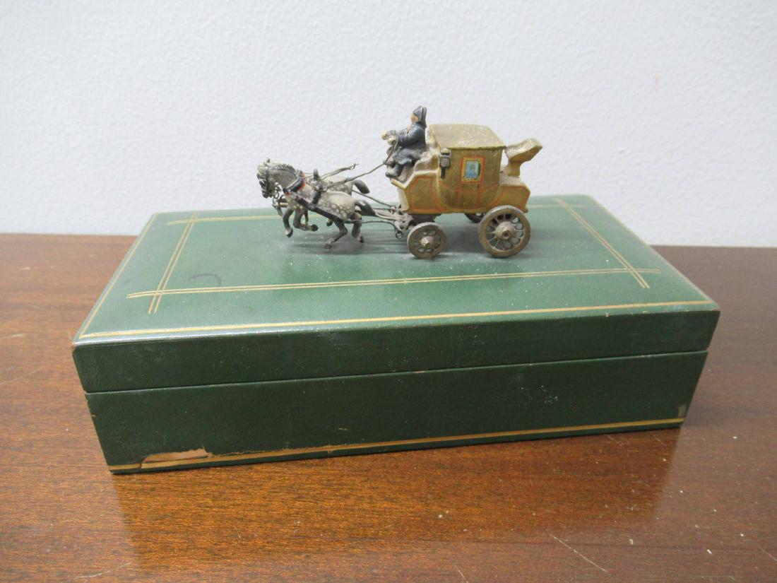 Green Leather Three Compartment Box: With carriage and horse finial. Box 2"h x 7 1/2"l x 3 1/2"d