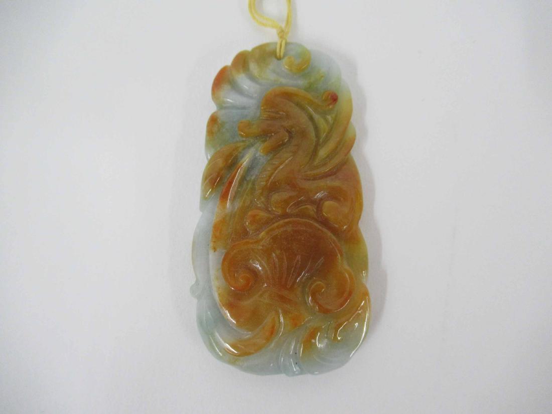 Six Carved & Polished Jade Pendants: Tones of green, brown & lavender. Ranging from 2-1/4"h x 1-3/4"w to 2-3/4"h x 1-3/4"w. From Claus Vollrath Inc., Mt. Kisco, New York.