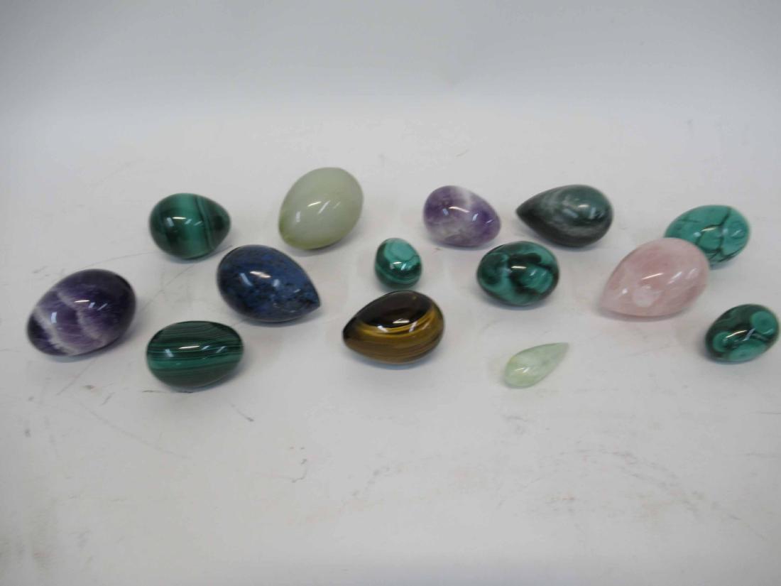 Group of Assorted Malachite Eggs: Together with Onyx, Amethyst, Rose quartz, tiger eye and other hard stone eggs.