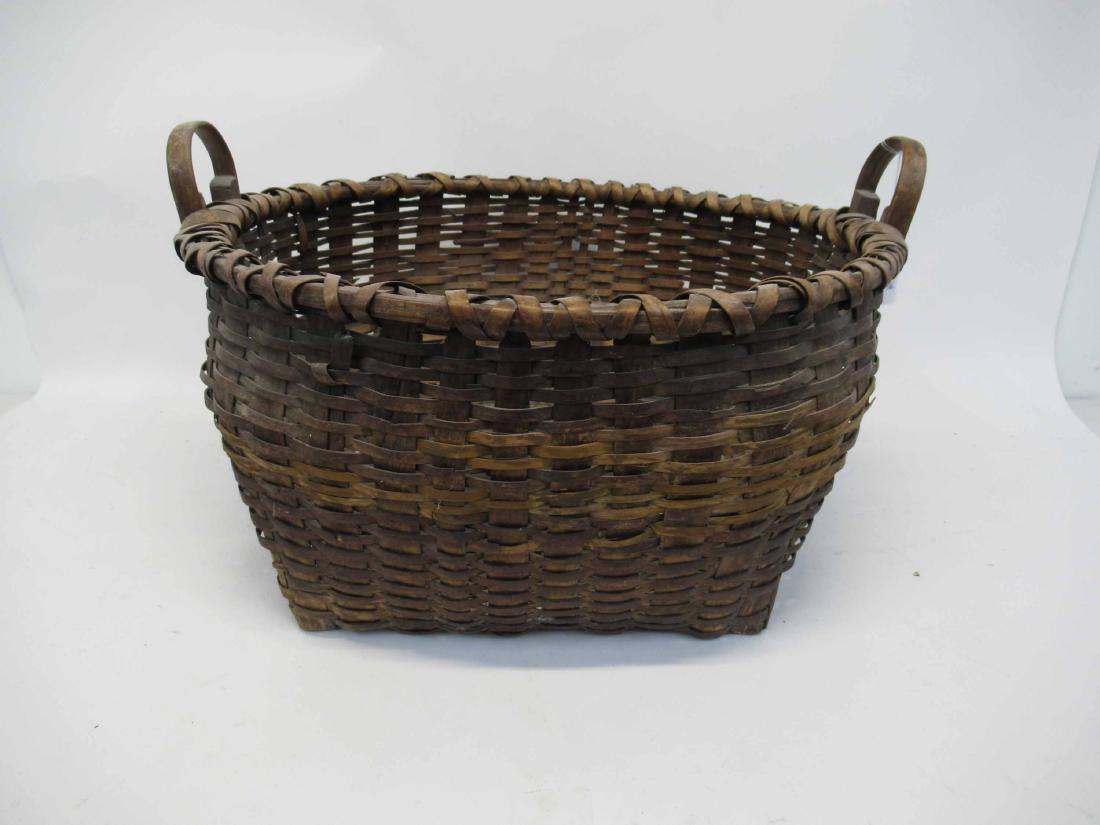 Antique Wooden Splint Harvesting Basket: Double handled woven basket, possibly Northeastern Native American. 22" wide x 24" wide x 14" tall