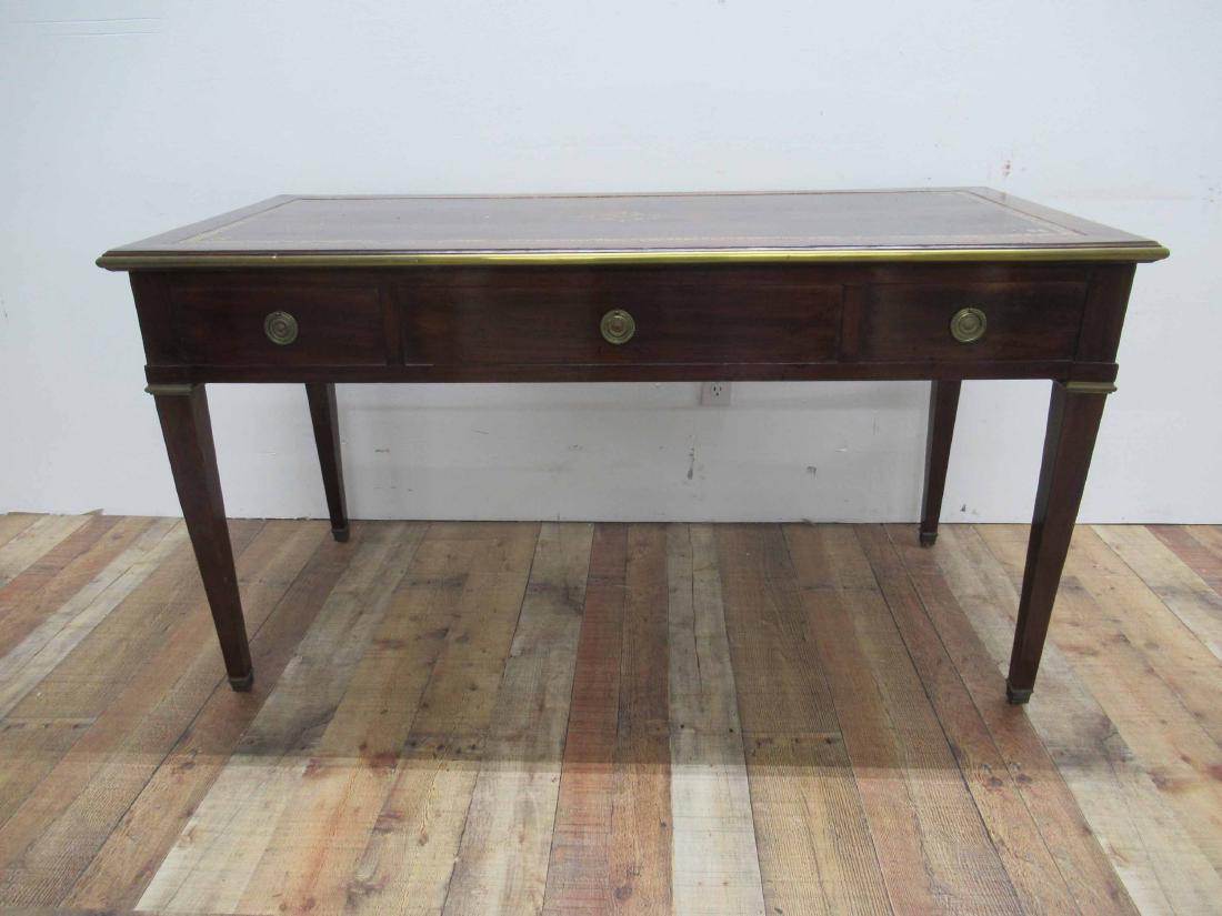 Antique Mahogany Writing Desk: Leather inset top with gilt decoration. Having three pull out drawers. 56 1/2" long x 26" wide x 30" tall