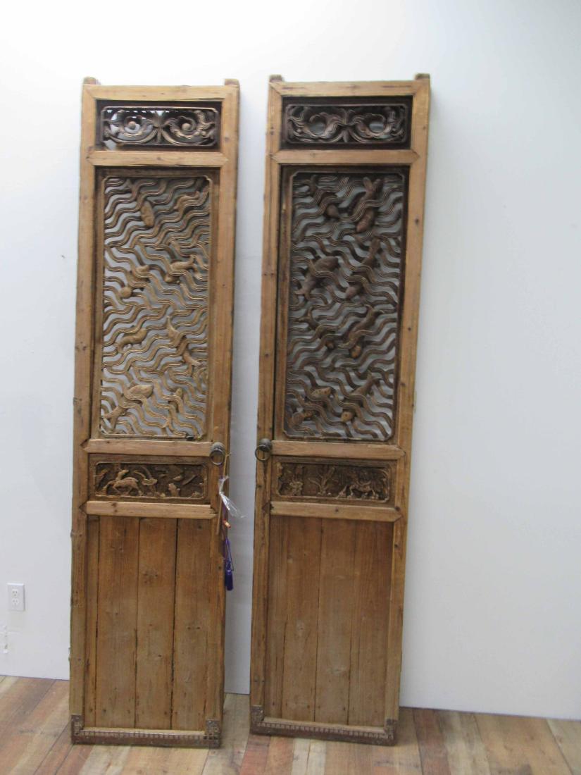 Antique Pair of Oriental Tall Doors.: Carved wooden doors with fish design. 91" tall x 21" wide x 2 1/2" thick
