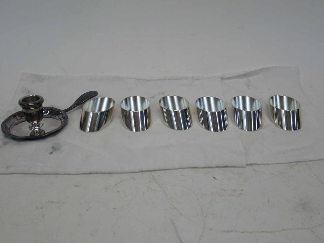 Christofle Paris Silver Plated Chamberstick: In original box. Together with a boxed set of metal napkin rings. Chamberstick, 4-3/4"l.