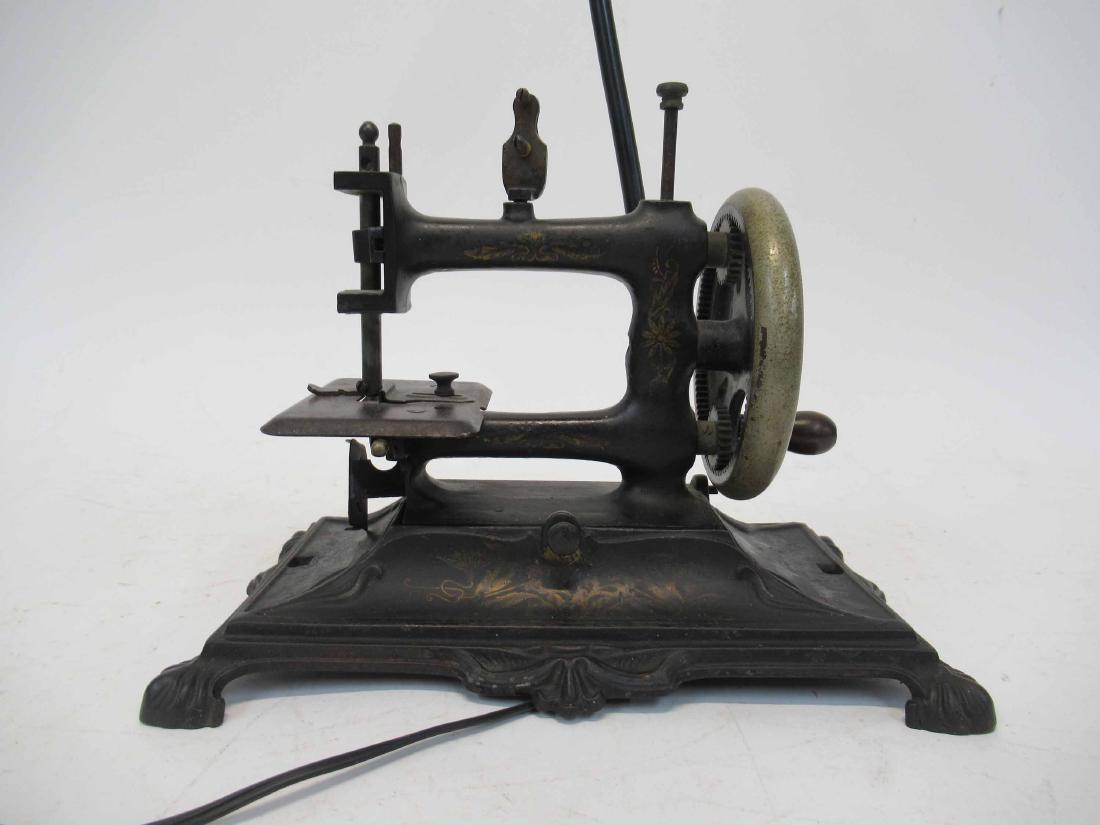 Vintage Hand Crank Sewing Machine: Electrified and mounted as lamp. 11" long x 6 1/2" wide x 20" to top of lamp