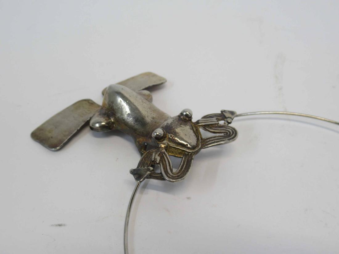 Group of Frog Motif Jewelry: Including pendant on wire necklace, pins, earrings. Pendant frog, 3-1/4"l.