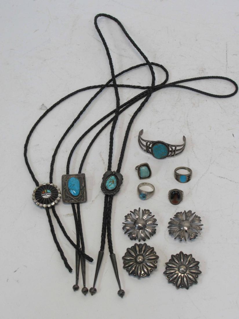 Group of Assorted South Western Jewelry: Turquoise. Including a bracelet, rings, a manta clasps and Bolas. Two Bolas marked Sterling silver Various