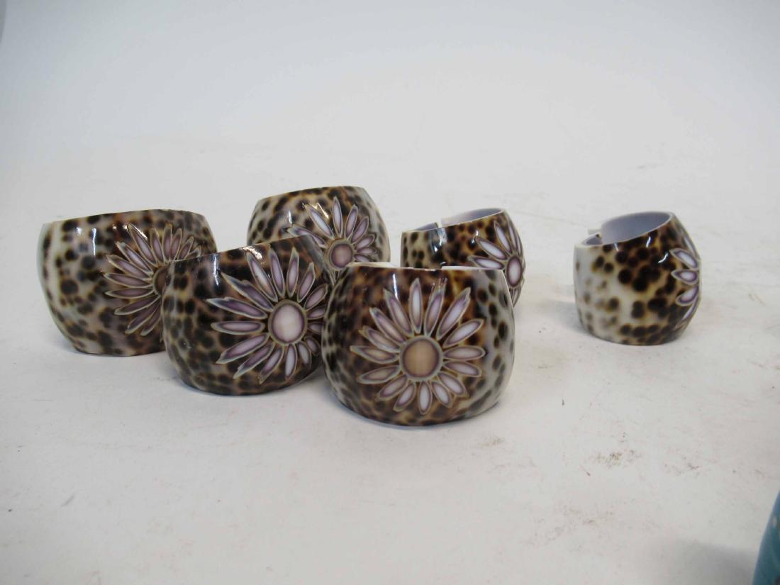 Set of 6 Sea Shell Form Napkin Rings: Together with a group of wooden figures.
