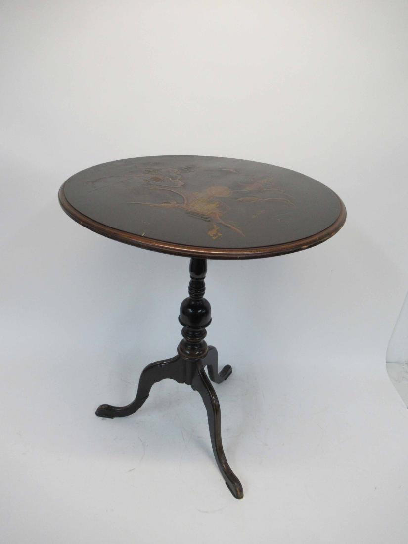 Oriental Style Tilt Top Table: Black lacquered with gilt decoration. 22" dia x 27" tall