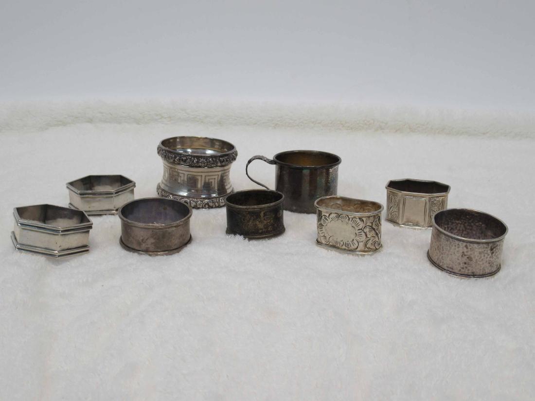 Eight Silver Napkin Rings: Five stamped sterling, with children's cup, weight approx. 4 T.O. Together with a child's silver handled and cased comb.