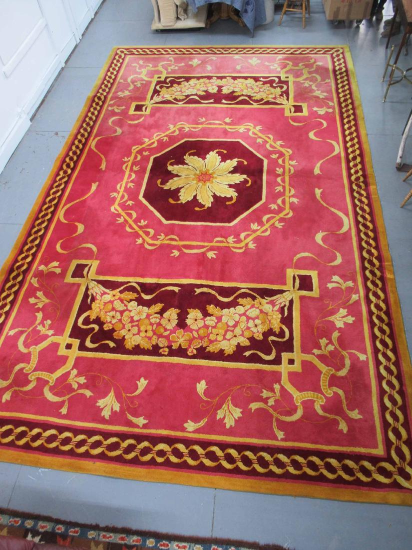 Edward Fields Massive Palace Size Rug: Central golden flower with burgundy background and all over pinkish ground. Some minor wear and stains. 19' 10" x 12'. Used, wear, worn