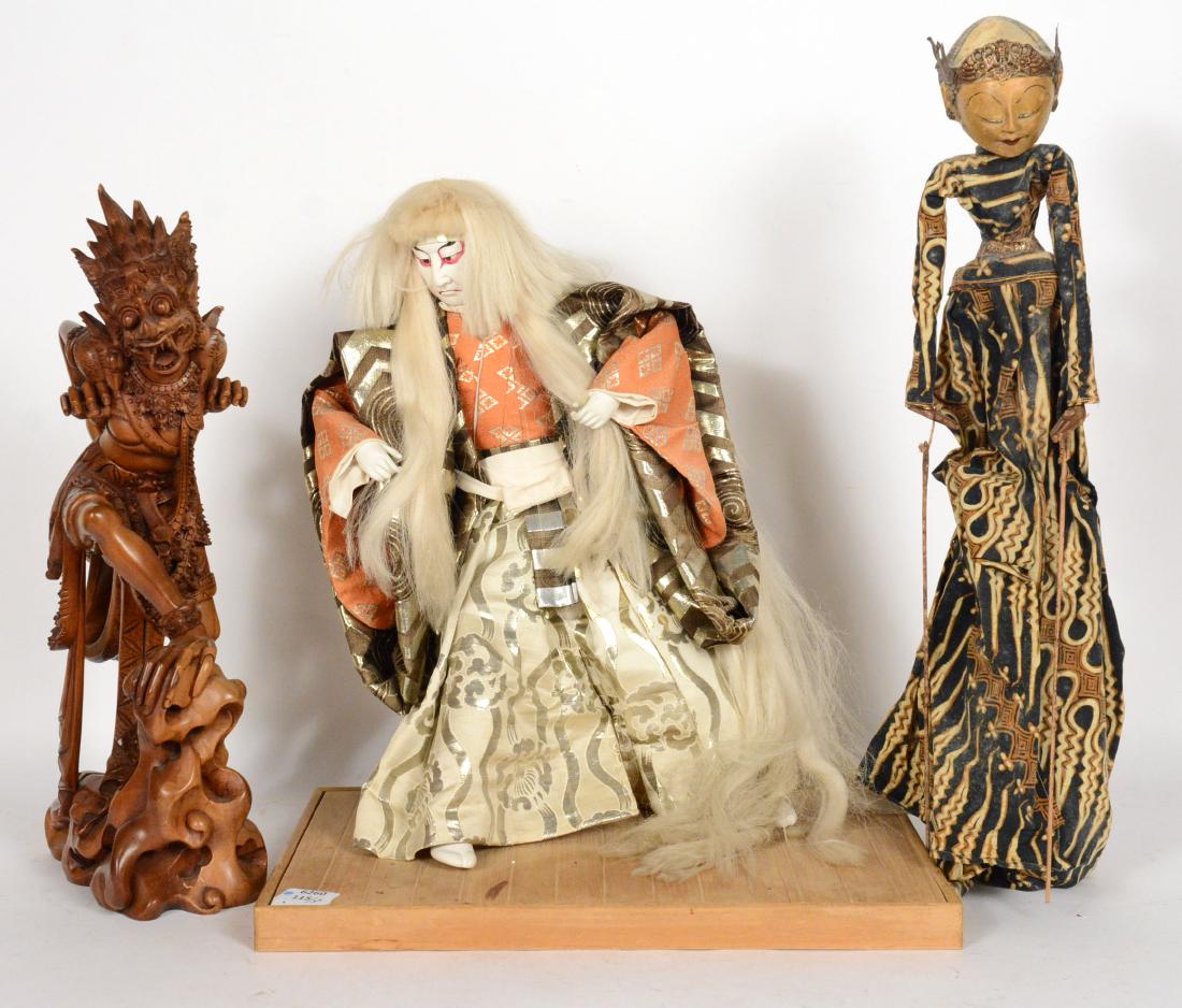 Japanese Samurai Figure: Together with a Thai carved wood Deity and a Thai puppet. Samurai 19 1/2"h Provenance: Property from the Collection of Dr. Andrew and Ziva Dahl. Samurai was formerly owned by Robert Wagner, mayor of N