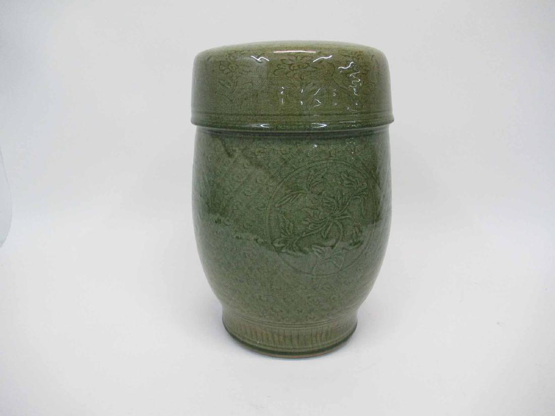Green Celadon Garden Seat: All over central foliate and vine motif. 15 1/2" tall x 10" dia. Used condition. Some natural cracking. open base.