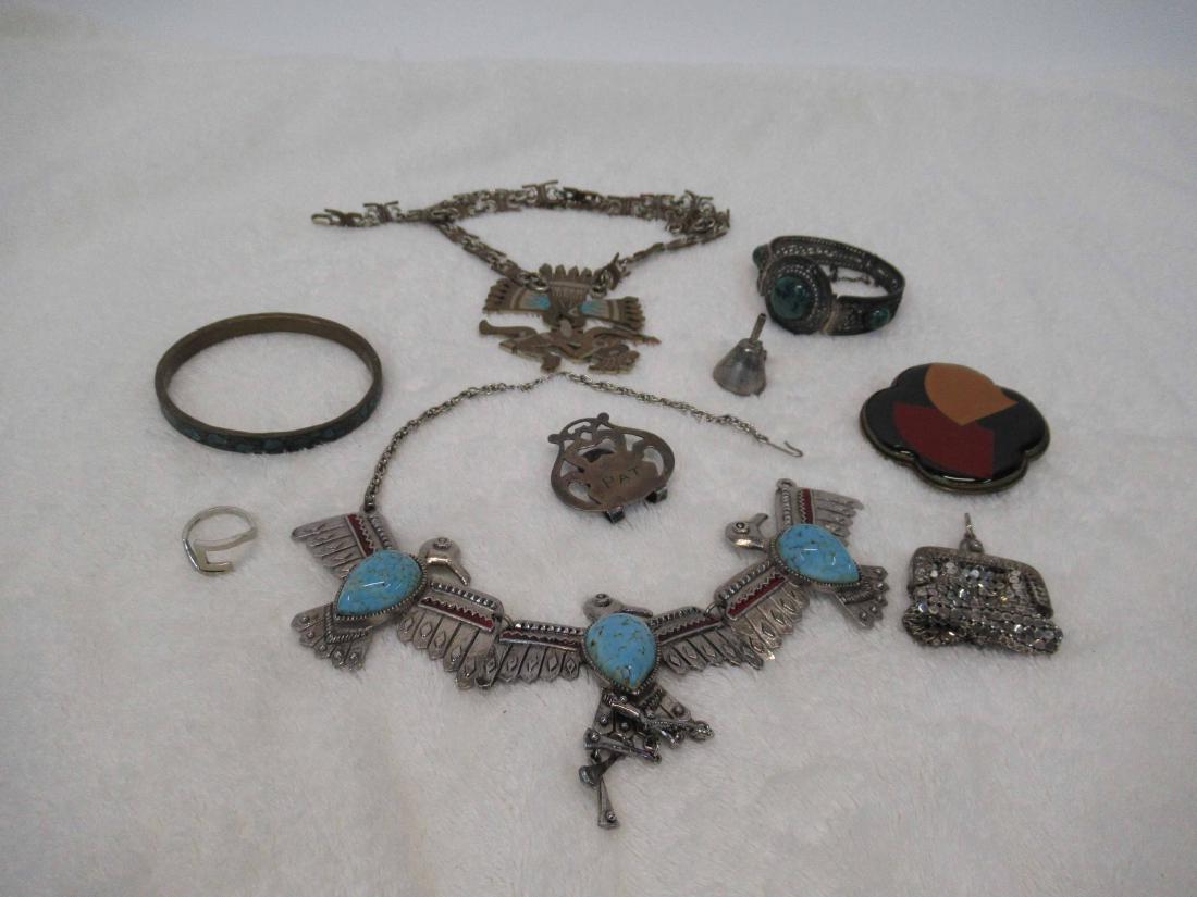 Group of Silver Metal Jewelry: Including ring, bracelets, necklaces, belt buckle, and sterling silver perfume funnel.
