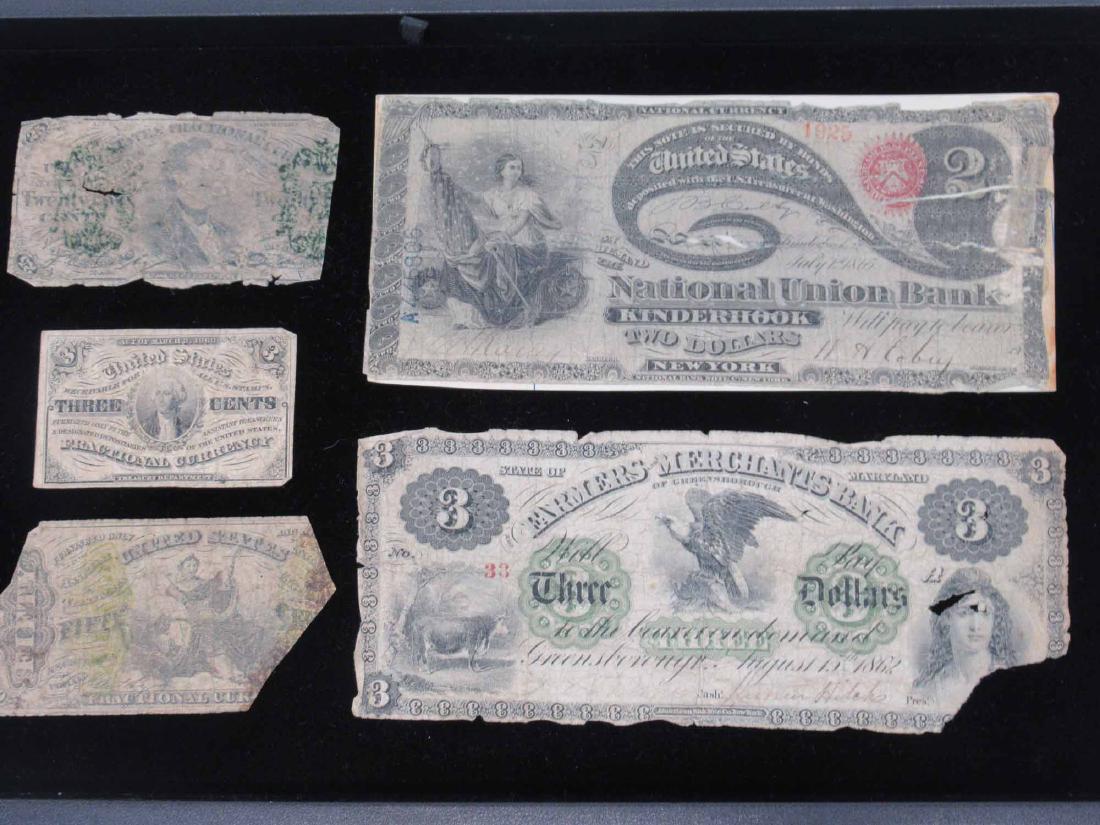 1865 National Union Bank Kinderhook: New York $2 note, laid down. Together with 1862 Farmers Merchants Bank $3 note State of Maryland of Greensborough and three fractional currency notes 3 cents, 25 cents, 50 cents. Each heavily worn wit