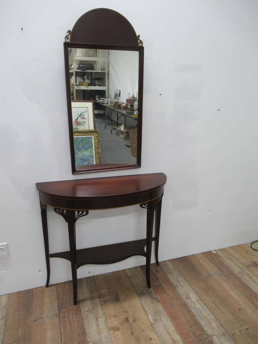 Mahogany Demilune Pier Table: Together with matching mirror, with maple inlay. Used condition, some surface distress. Table: 32"h x 36"w x 13"d