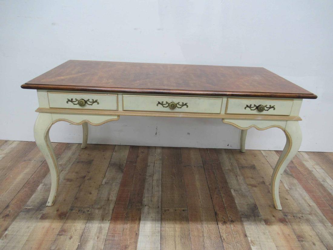 French Provincial Writing Desk: Single central drawer flanked by 2 short drawers resting on a white painted base. Made by Hickory Manufacturing Co. Used condition, Paint loss, some surface distress to top. 58" long x 29" high x 28"