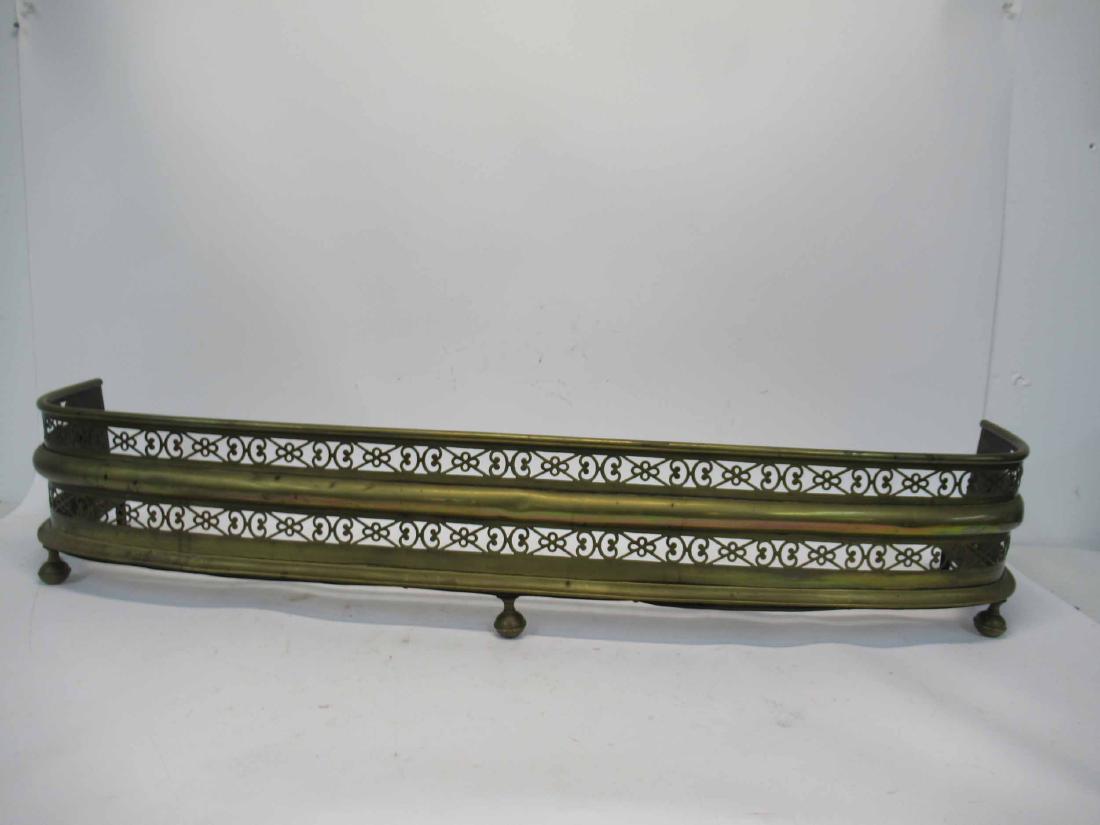 Antique Brass Fire Fender: With pierced scroll design on bun feet. 8"h x 45"w x 9"d