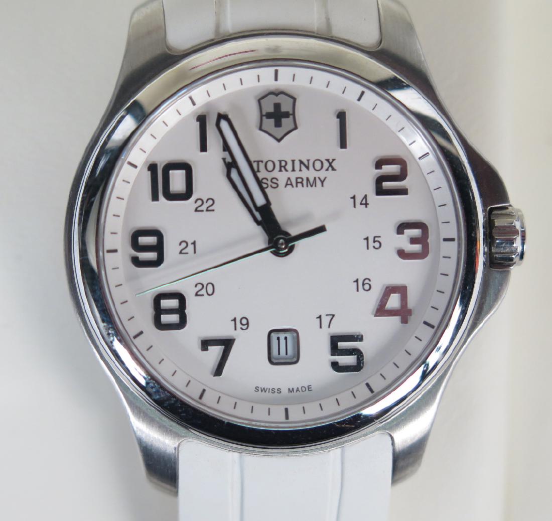 Victorinox Swiss Army Watch: White rubber band, in original box and papers. Excellent condition.