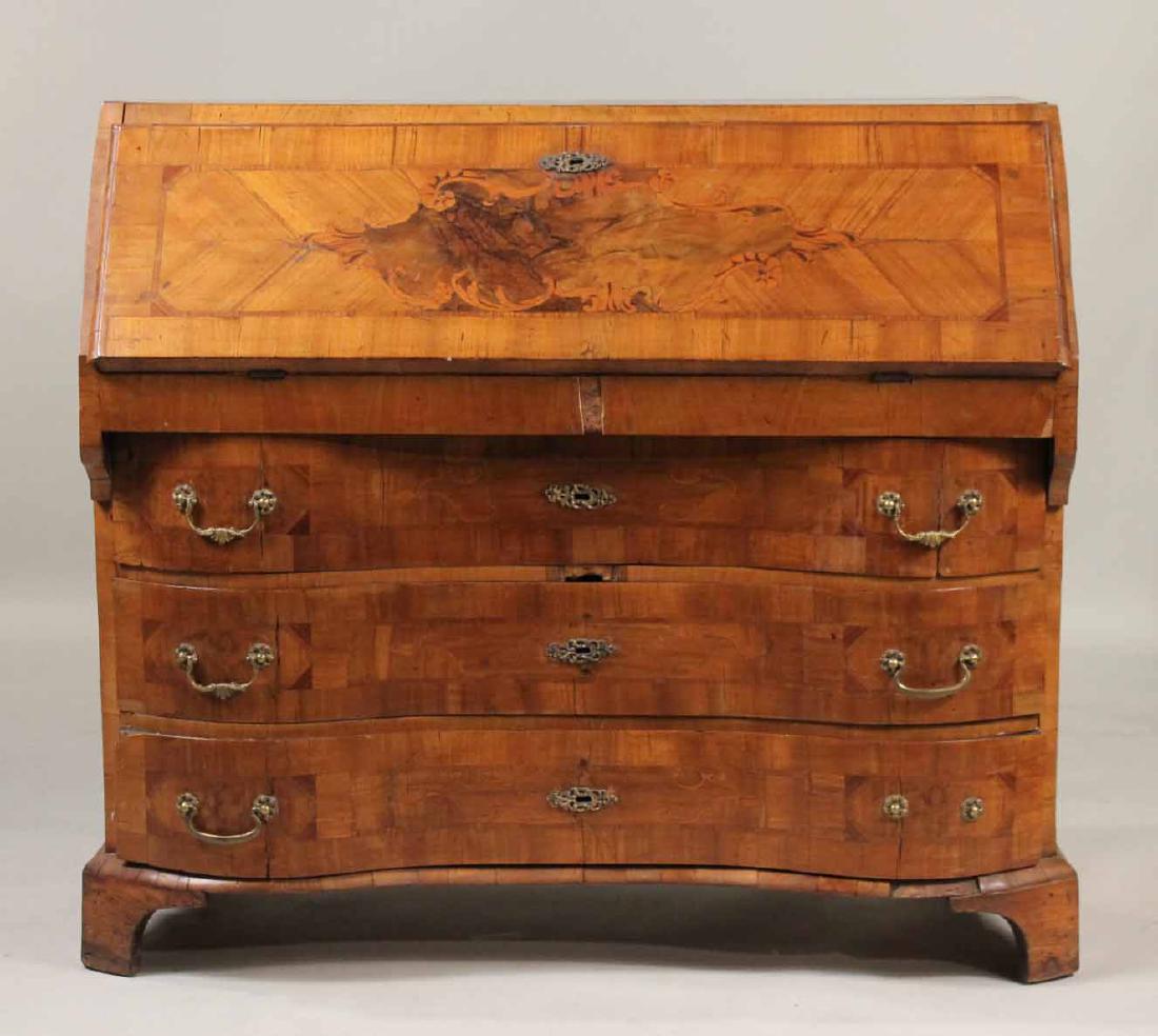 Biedermeier Walnut Serpentine Slant Front Desk: German, c. 1760. Many losses to inlay and molding, repair to rear right foot. 39-1/4"h x 44"w x 22"d