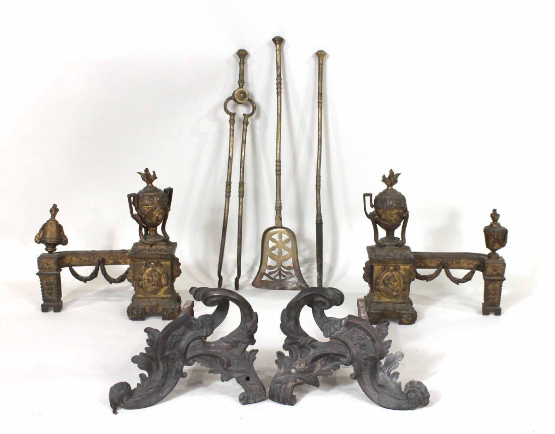 Group of French Brass Fireplace Accessories: Comprising, a pair of Louis XV chenets, a pair of Louis XVI style chenets, a set of firetools, comprising a poker, tongs, and shovel. 7 pieces Chenet: 15-1/2"h x 14-1/2"w x 6"d and 9"h x 12"w x 15"d S