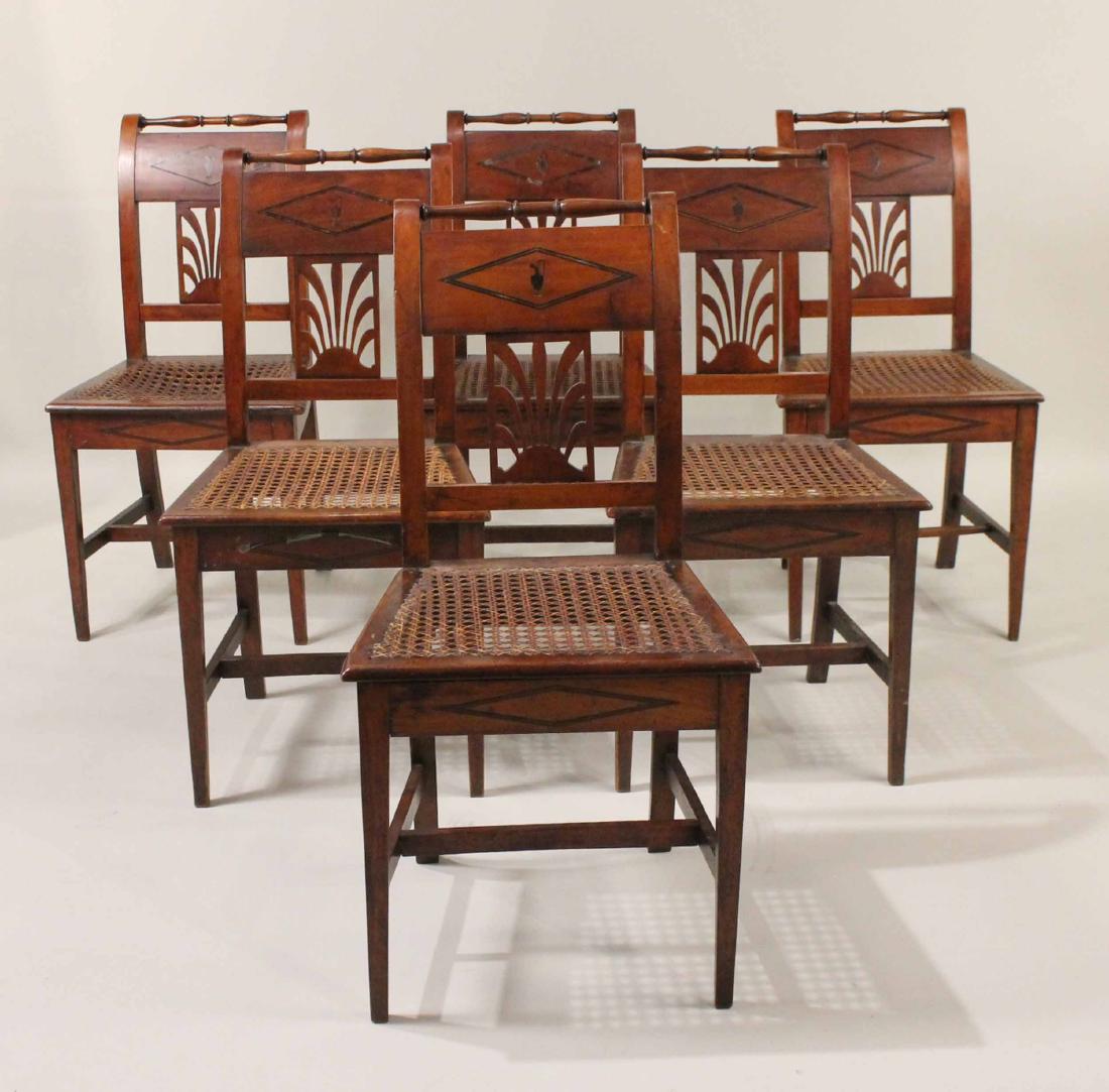 Six Directoire Fruitwood Side Chairs: Continental, c. 1810, with caned seats and urn inlay. Losses to caning, repairs. 34"h x 17-1/2"w x 15"d