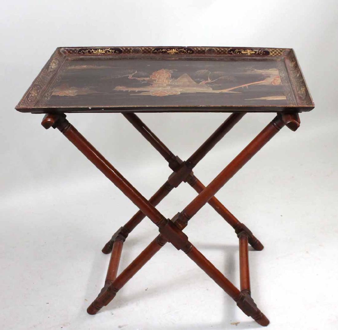 Venetian Black and Gold Lacquer Tray: Italian, c. 1760. Together with an English Victorian coaching stand. 2 pieces Tray: 30"h x 19-1/2"w, stand: 28"h x 27"w x 19-1/2"d