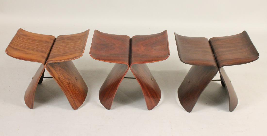 Matched Pair of Sori Yanagi Butterfly Stools: C. 1960. Togehter with a reproduction Sori Yanagi Butterfly stool, c. 2014. 15-1/4"h x 16-3/4"w x 12"d