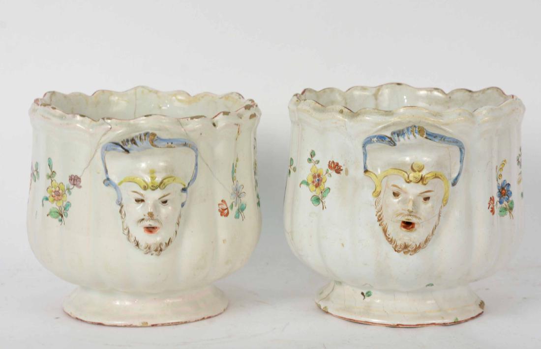 Two French Faience Bottle Coolers: Mid 18th C. Floral decorated with handles depicting male busts. 6"h x 6"d Selmar Rosenau, Paris