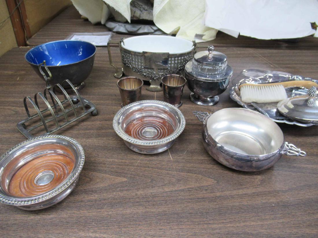 Group of Assorted Silver Plated Table Articles: Group of Assorted Silver Plated Table Articles including Lyford Cay Club 1983 and 1985 wine coaster trophies and other assorted table articles. Used condition, wear, worn.