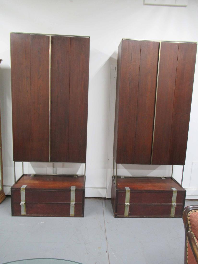 Pair of Modern Crucible Wall Cabinets: Pair of Modern Crucible Furniture Company Wall Cabinets Each having 2 swing doors flanked by shelves on one side resting above a two drawer base cabinet. Used condition, wear, worn, chips, surface dis