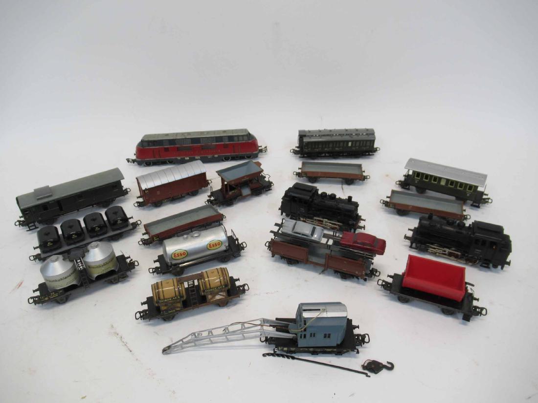 Group of Assorted Marklin Train Cars: Group of Assorted Marklin Train cars HO Gauge including V200006, 89028, 89005. Together with assorted train cars, buildings and scenery, assorted tracks. Used condition, wear, worn, missing pieces. Un