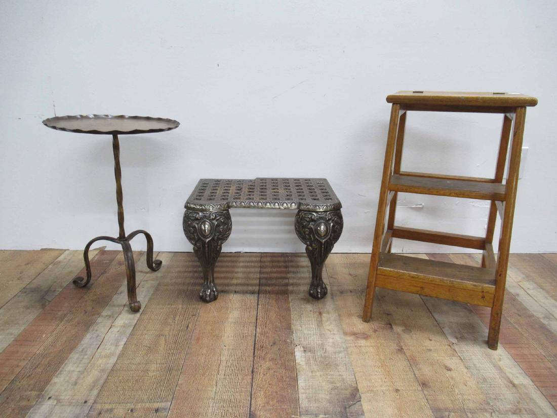 Iron Fire Trivet Footman: Iron Fire Trivet Footman, damaged in two pieces. Together with a wooden Step stool and Metal occasional table. Used condition, surface distress.