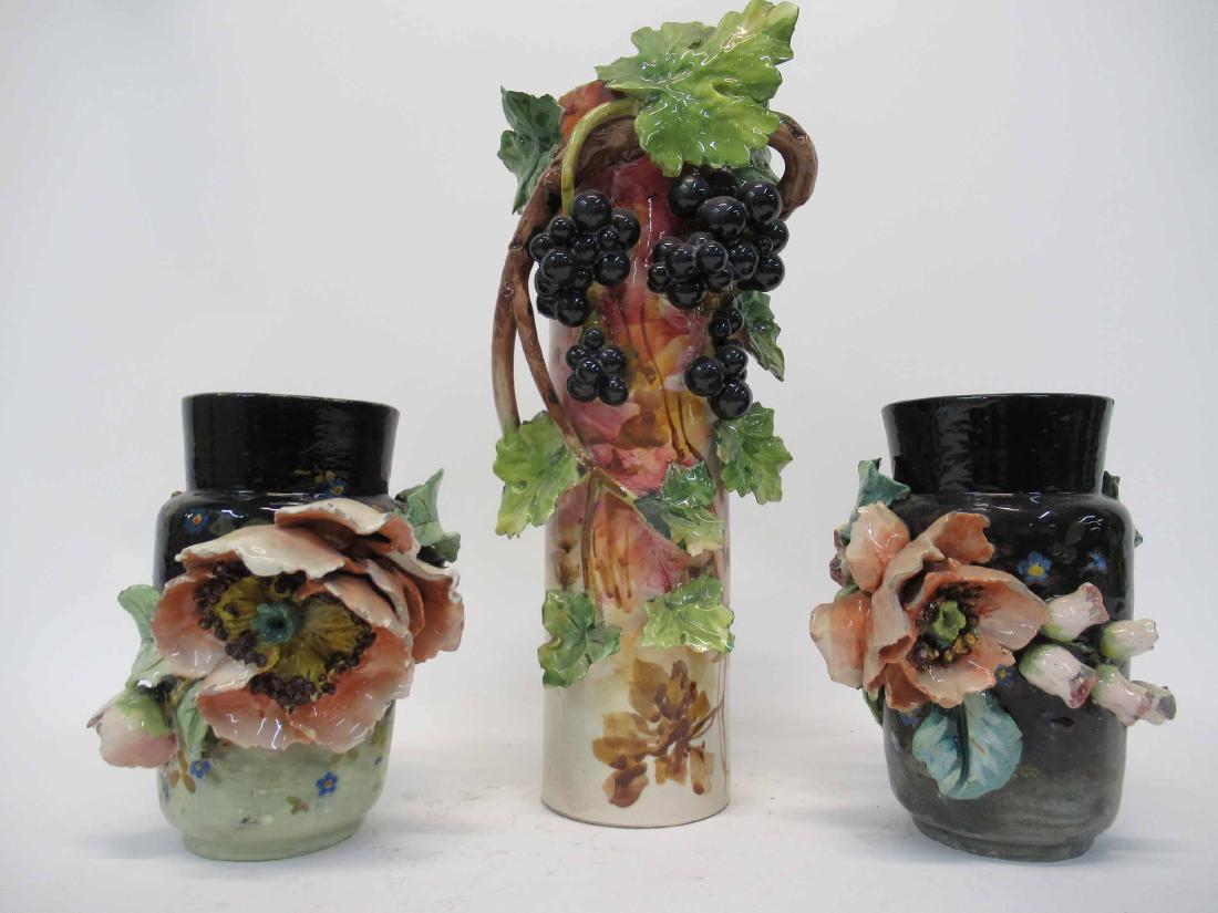 Pair of Majolica Floral Urns: Pair of Majolica Floral Urns Marked B.G. on underside together with a similar vase, a boy holding two baskets and Blessings on Thee barfoot boy cookie jar. Used condition, wear, worn, chips, broken fl