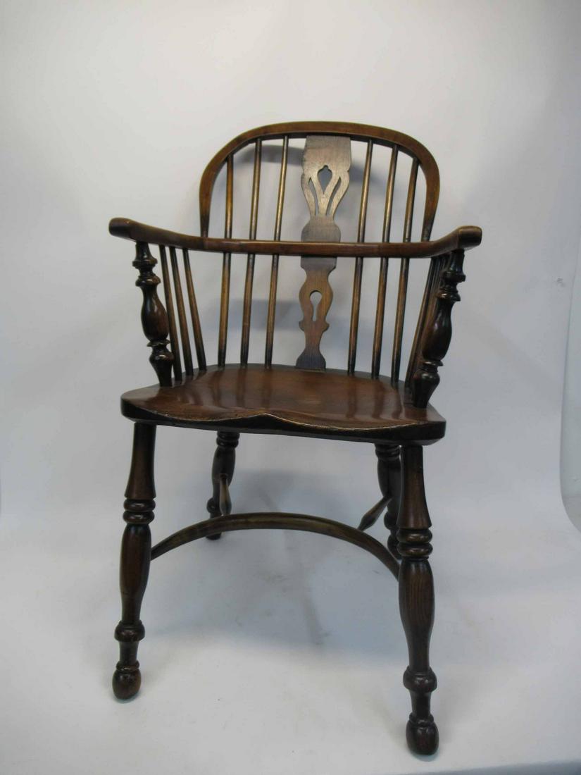 Set of Elmwood Windsor Chairs: Set of Elmwood Windsor Chairs, one arm and one side chair. used condition, Missing piece of foot, wear. 35" tall